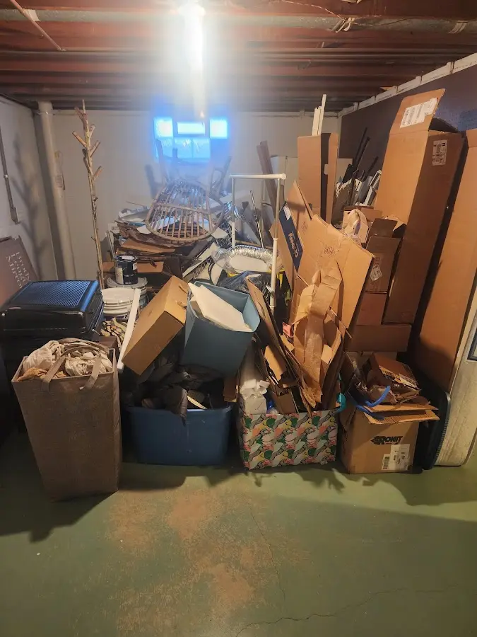 Roll-off dumpster container at job site for 2 Yard Dumpster Rental in Tiffin